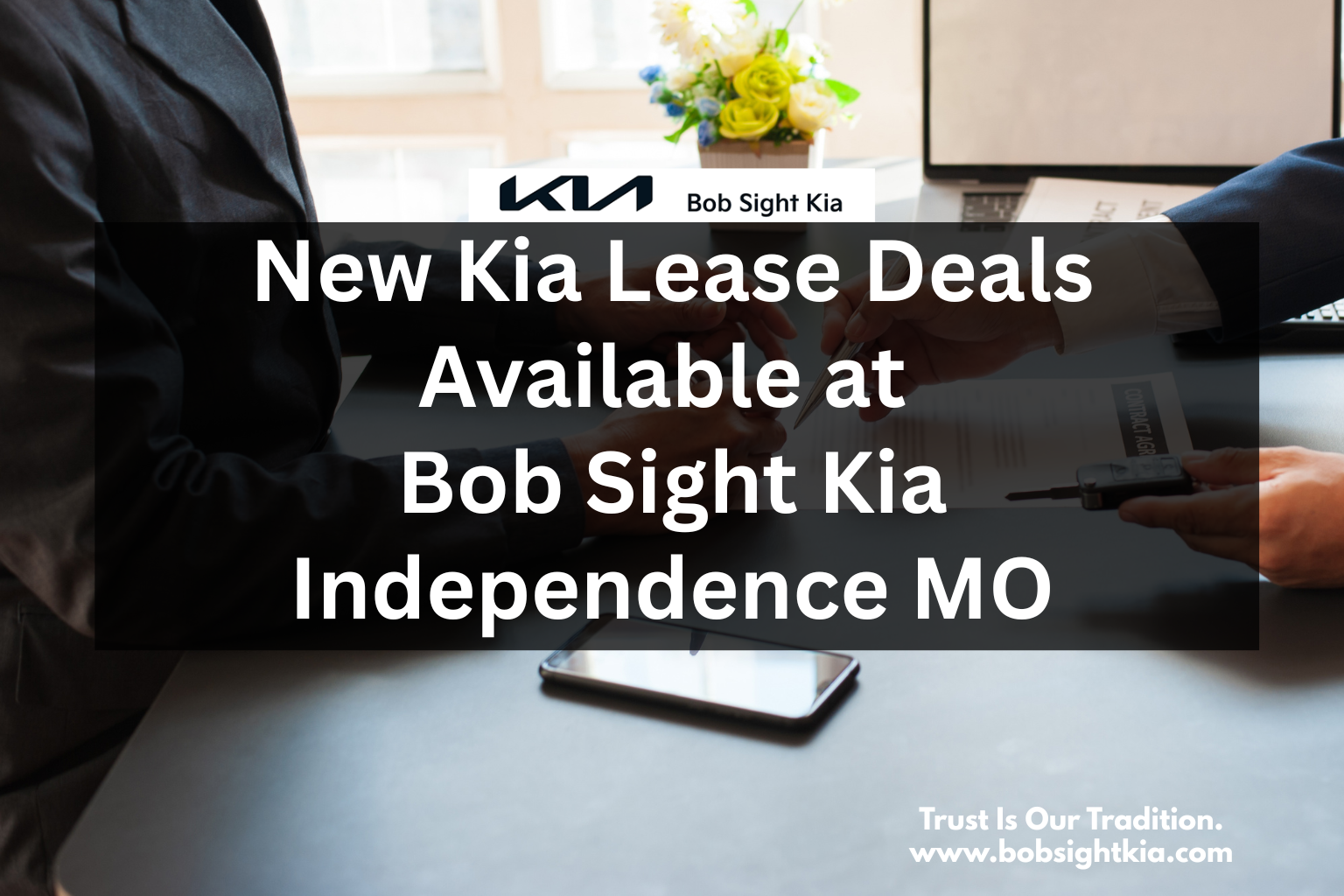 Customer exploring Kia lease deals with a sales consultant at Bob Sight Kia in Independence MO, serving Lee’s Summit, Blue Springs, and Kansas City Metro.