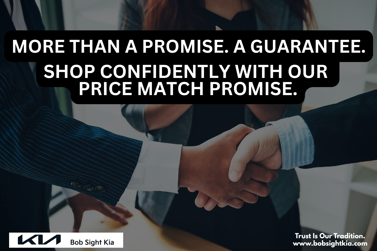 Bob Sight Kia sales team standing behind price match guarantee sign
