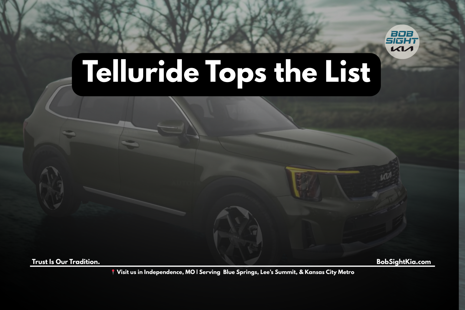 Kia Telluride driving through a side street Kansas City with Missouri sunset in the background.