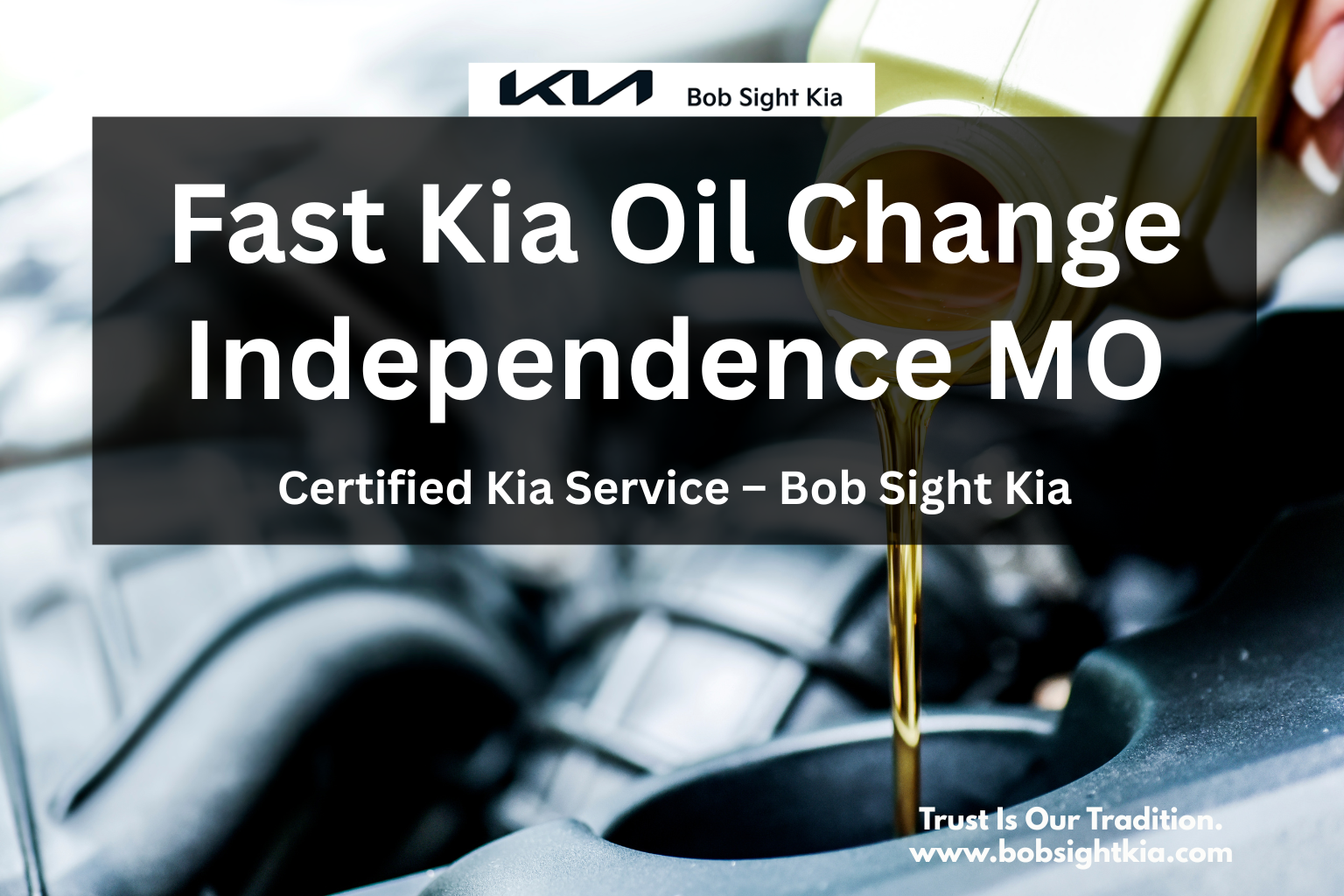 Technician performing Kia oil change at Bob Sight Kia in Independence MO
