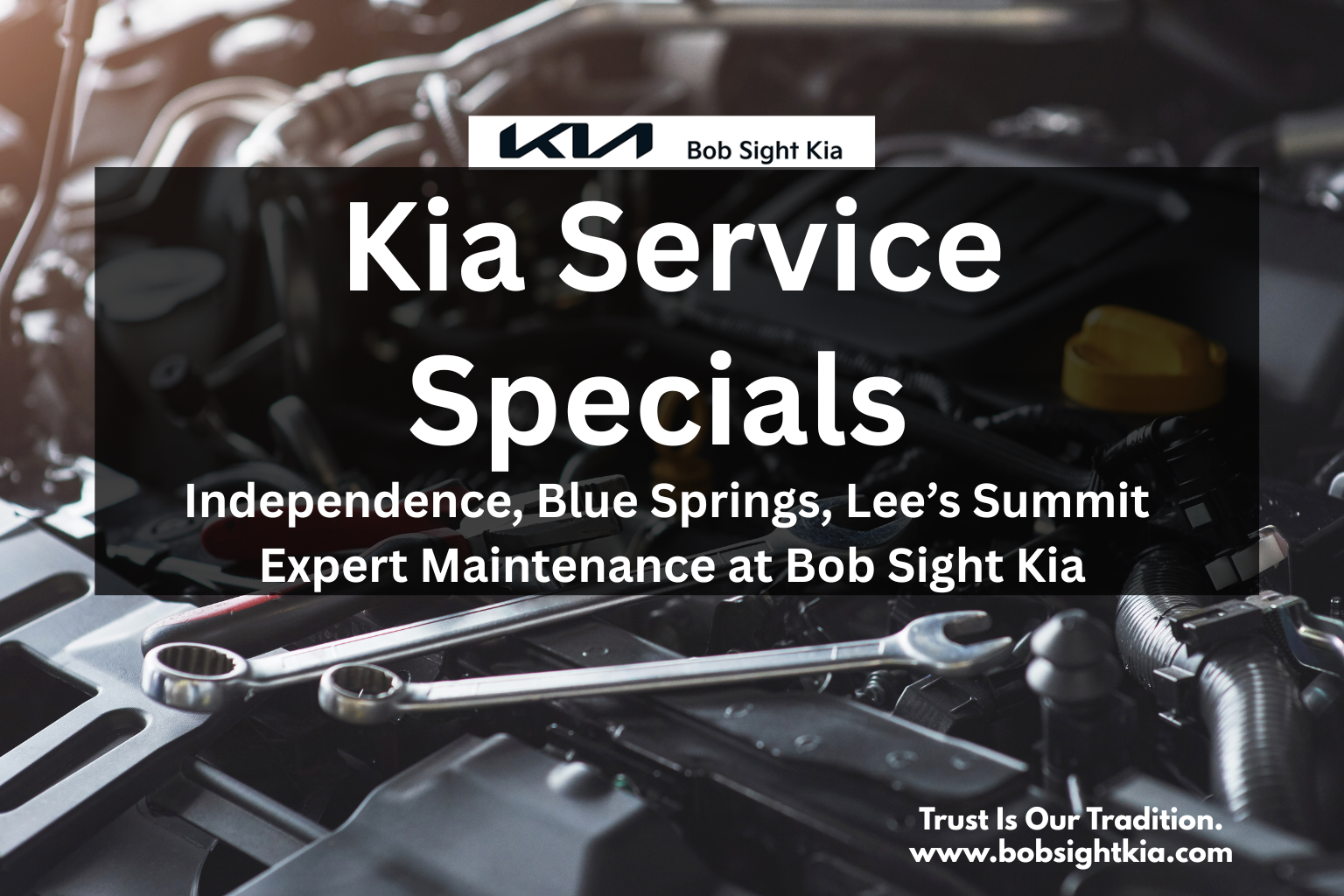 Service technician performing maintenance on a Kia vehicle at Bob Sight Kia in Independence MO.