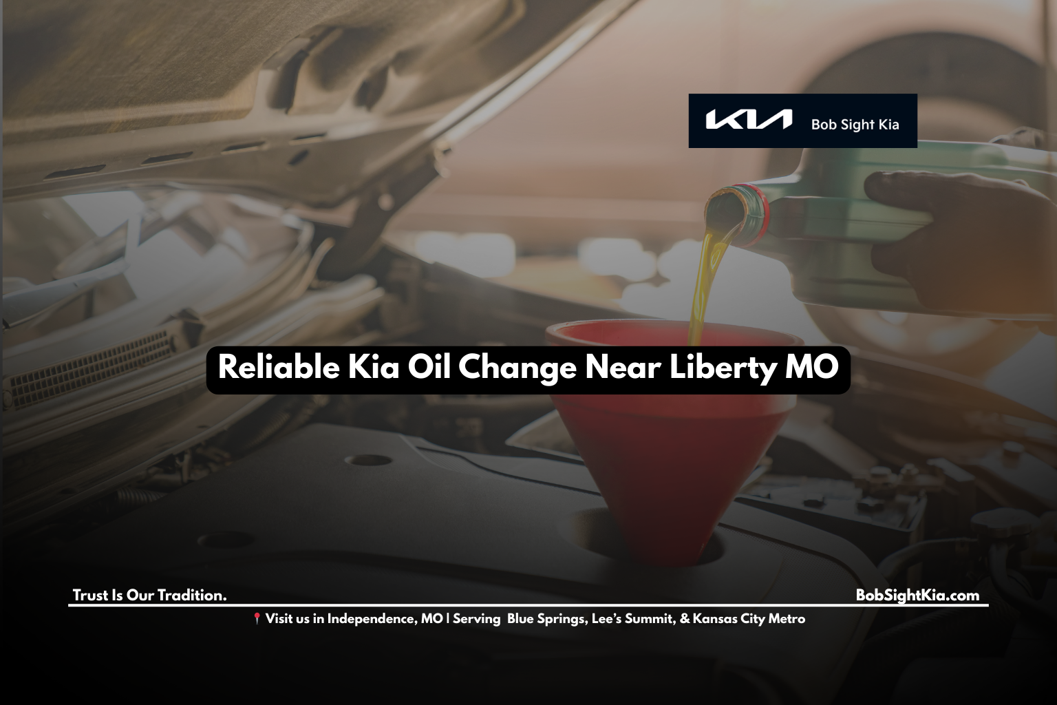Kia technician performing oil change near Liberty MO at Bob Sight Kia Independence