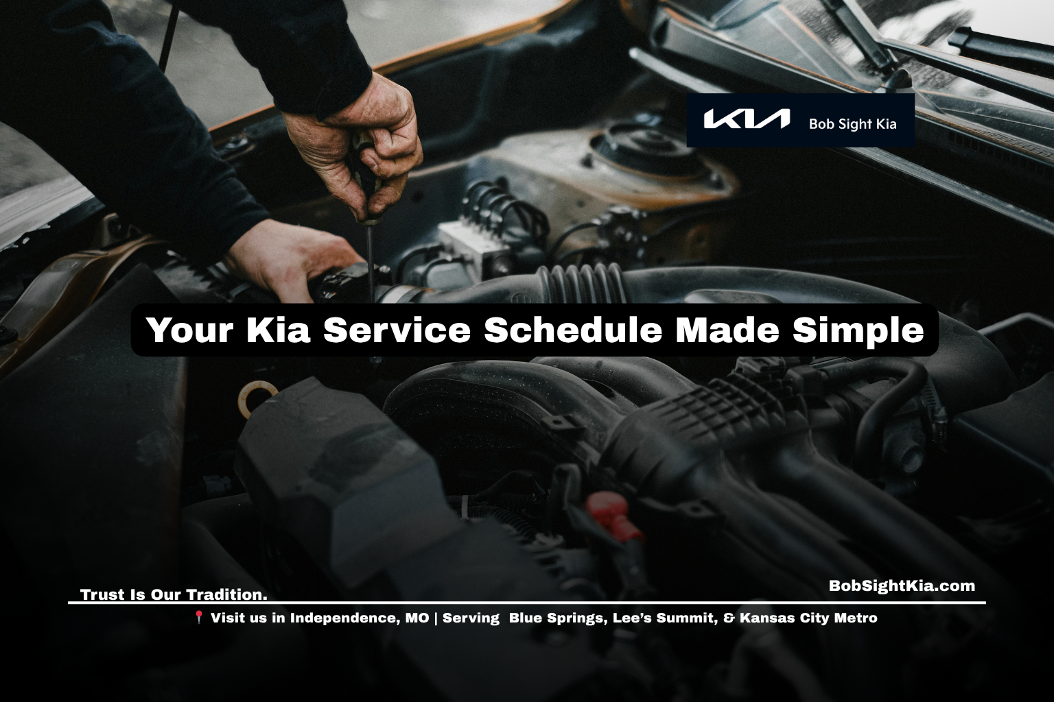 Kia service technician performing a maintenance inspection at Bob Sight Kia in Independence Missouri.