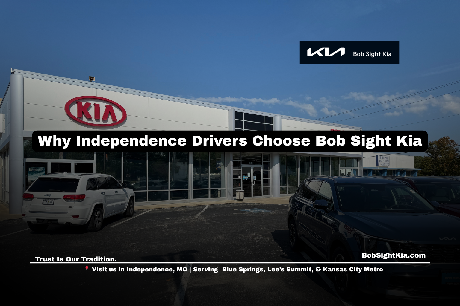 Customers shopping for a new Kia at Bob Sight Kia in Independence Missouri with the dealership displayed in the background.